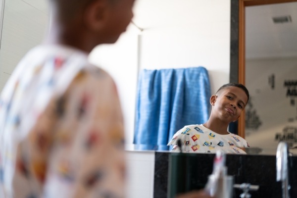 boy looking in miror